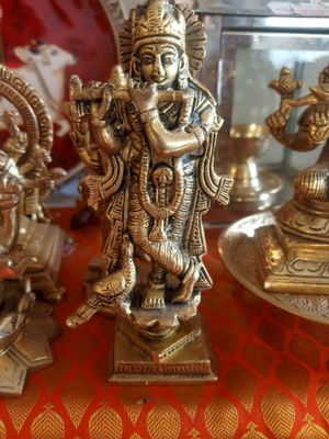 Brass krishna with peacock