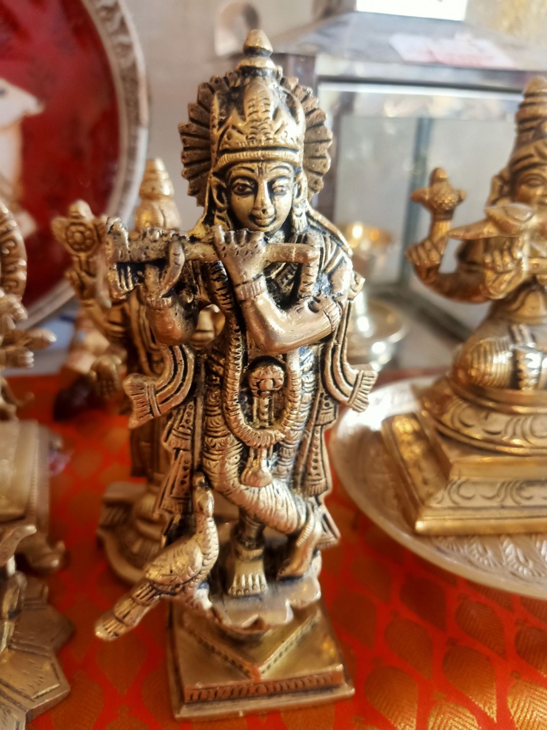 Brass krishna with peacock
