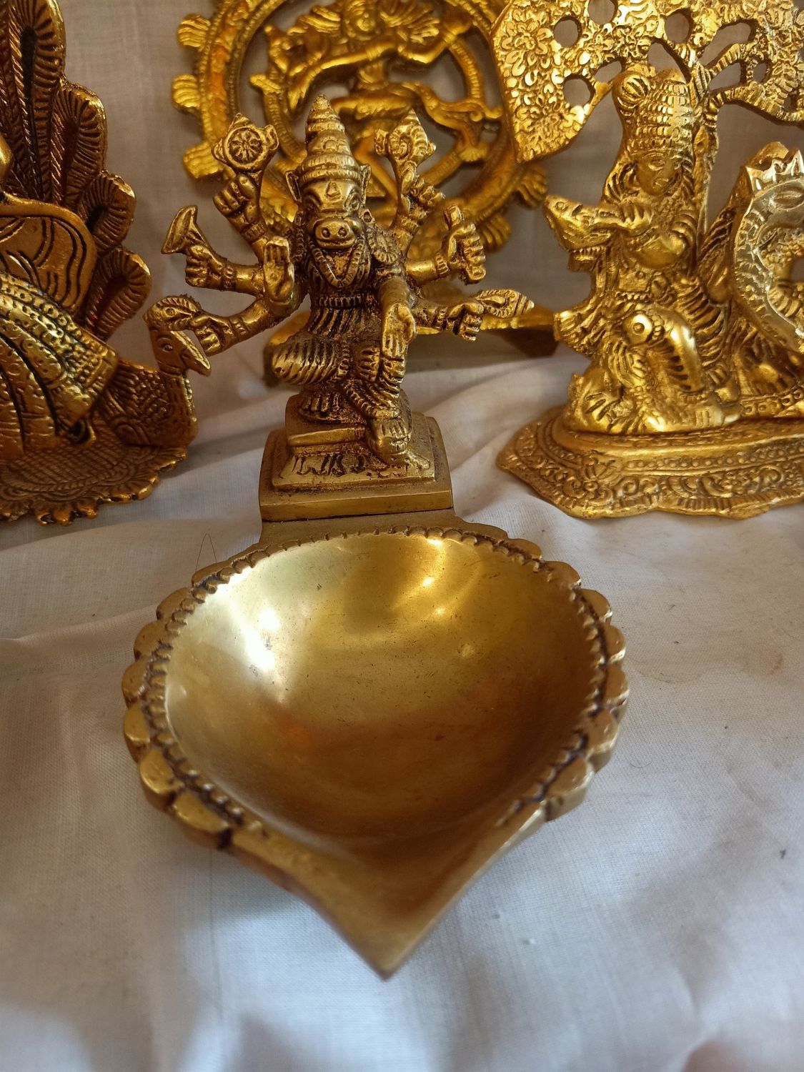 Brass varahi devi with diya