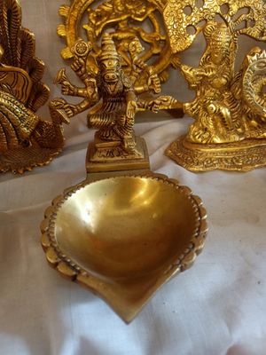 Brass varahi devi with diya