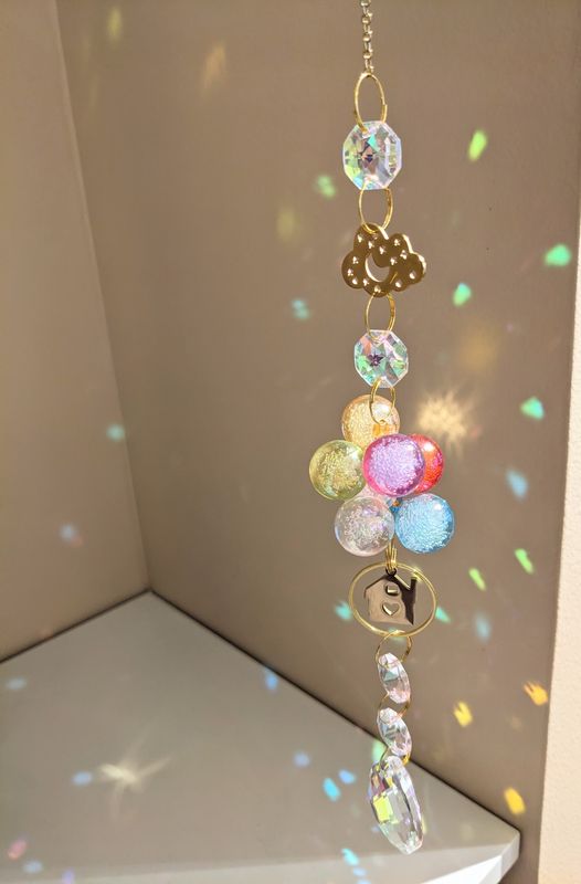 Attrape soleil à chaîne unique "laisse-toi porter..."