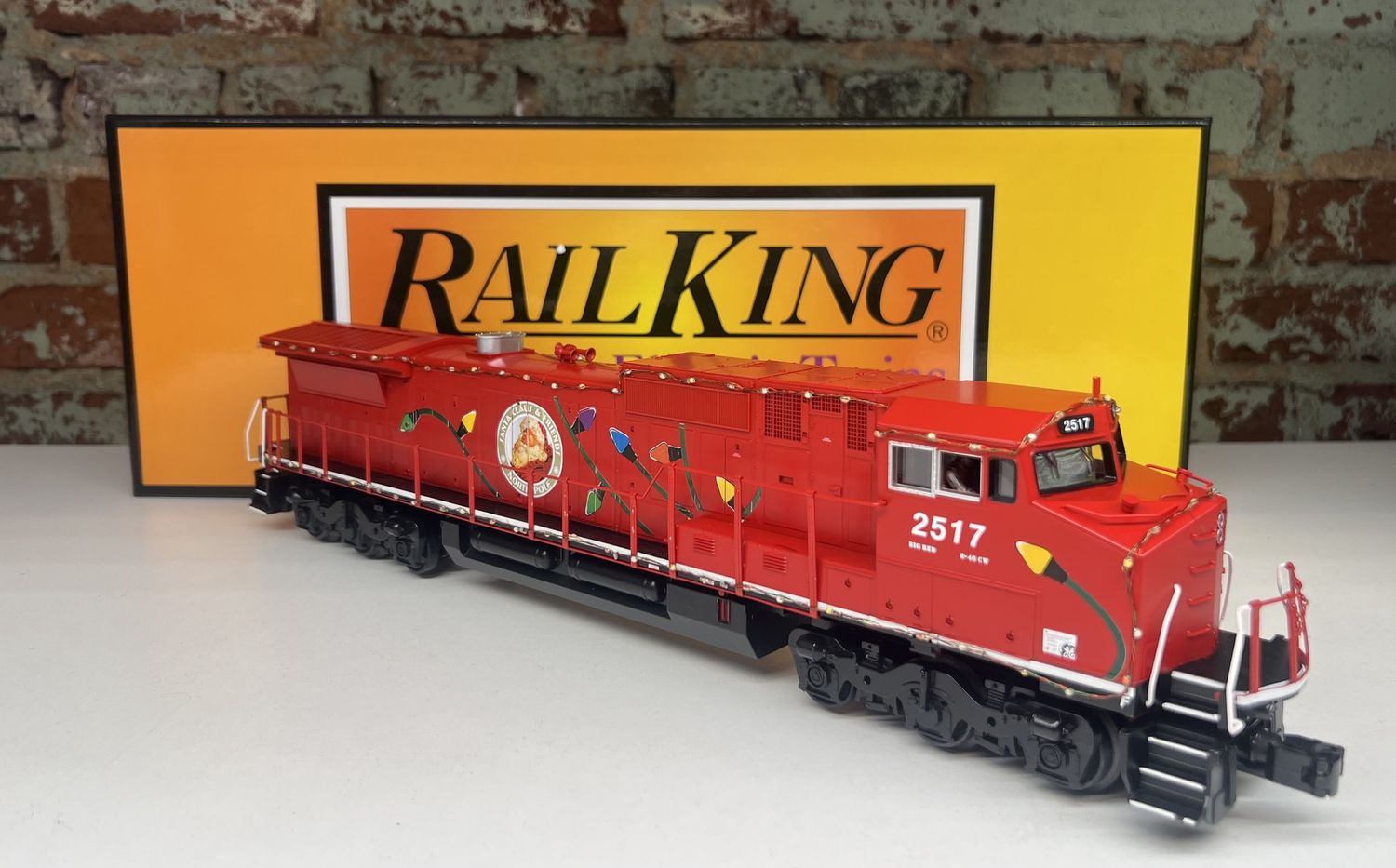 PRE-OWNED RAILKING 30-20436-1 CHRISTMAS DASH-8 DIESEL ENGINE W/PS3 AND LED LIGHTS