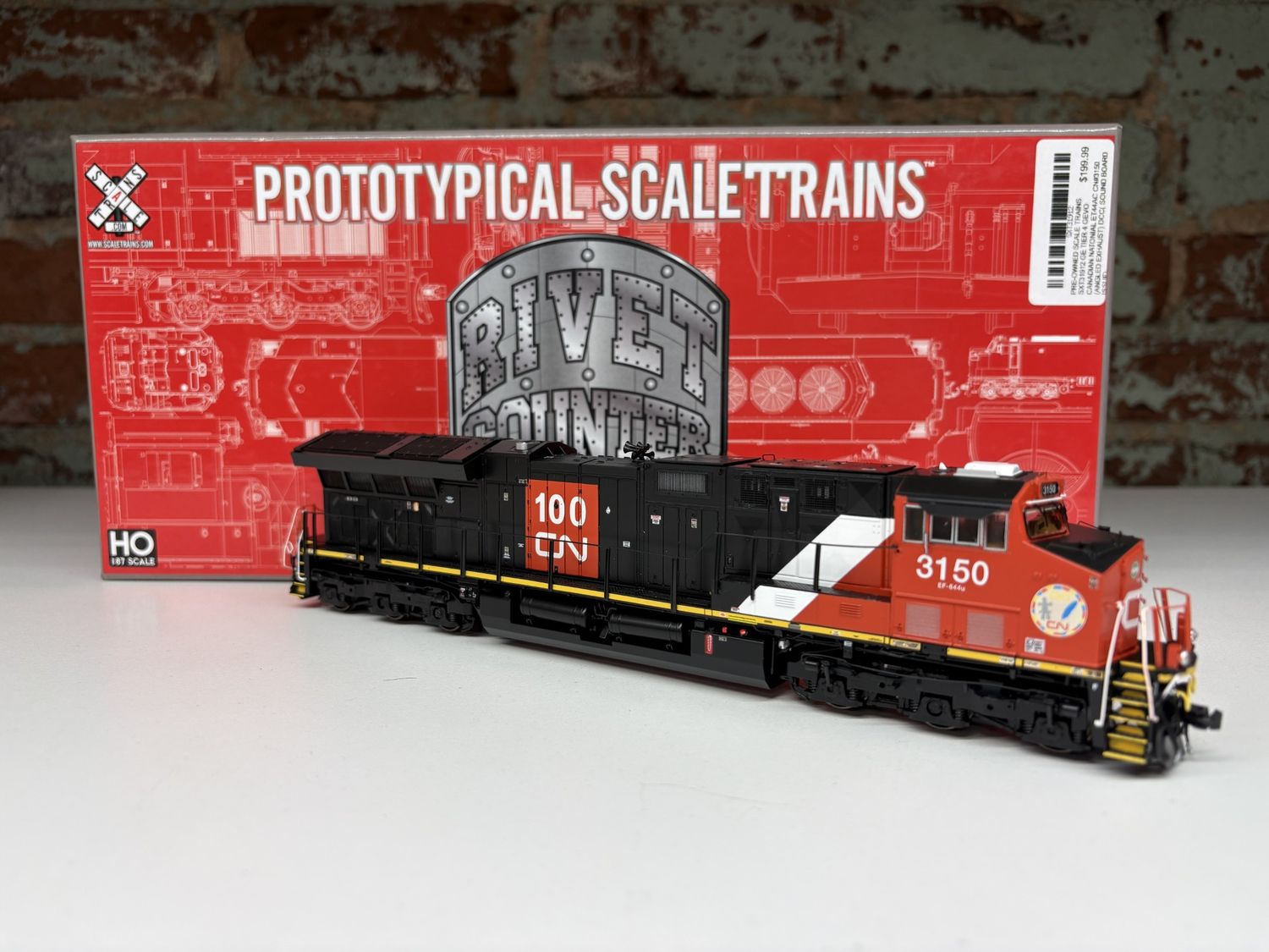 PRE-OWNED SCALE TRAINS SXT31912 GE TIER 4 GEVO CANADIAN NATONIAL ET44AC CN#3150 (ANGLED EXHAUST)  DCC( SOUND BOARD ISSUE)