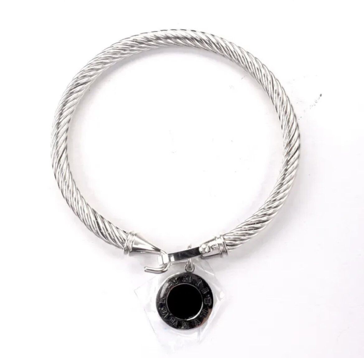 Silver bangle with black dial disc