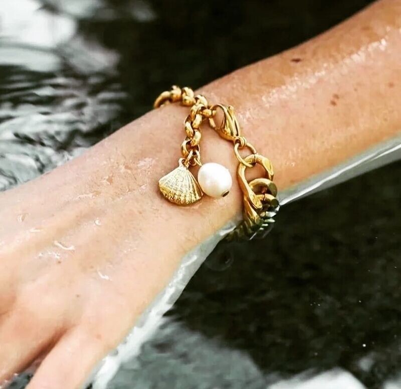 Chunky gold bracelet with shell and pearl drop