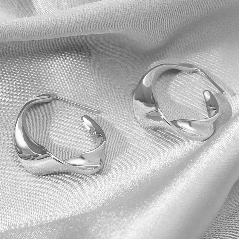 Chic twisted silver hoops
