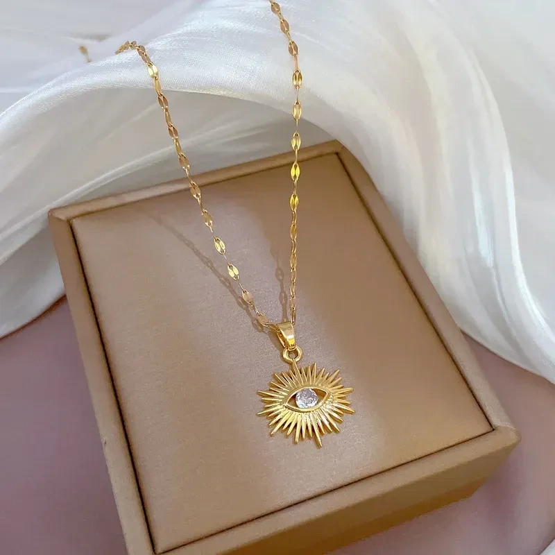 Gold devils eye pendant with diamante