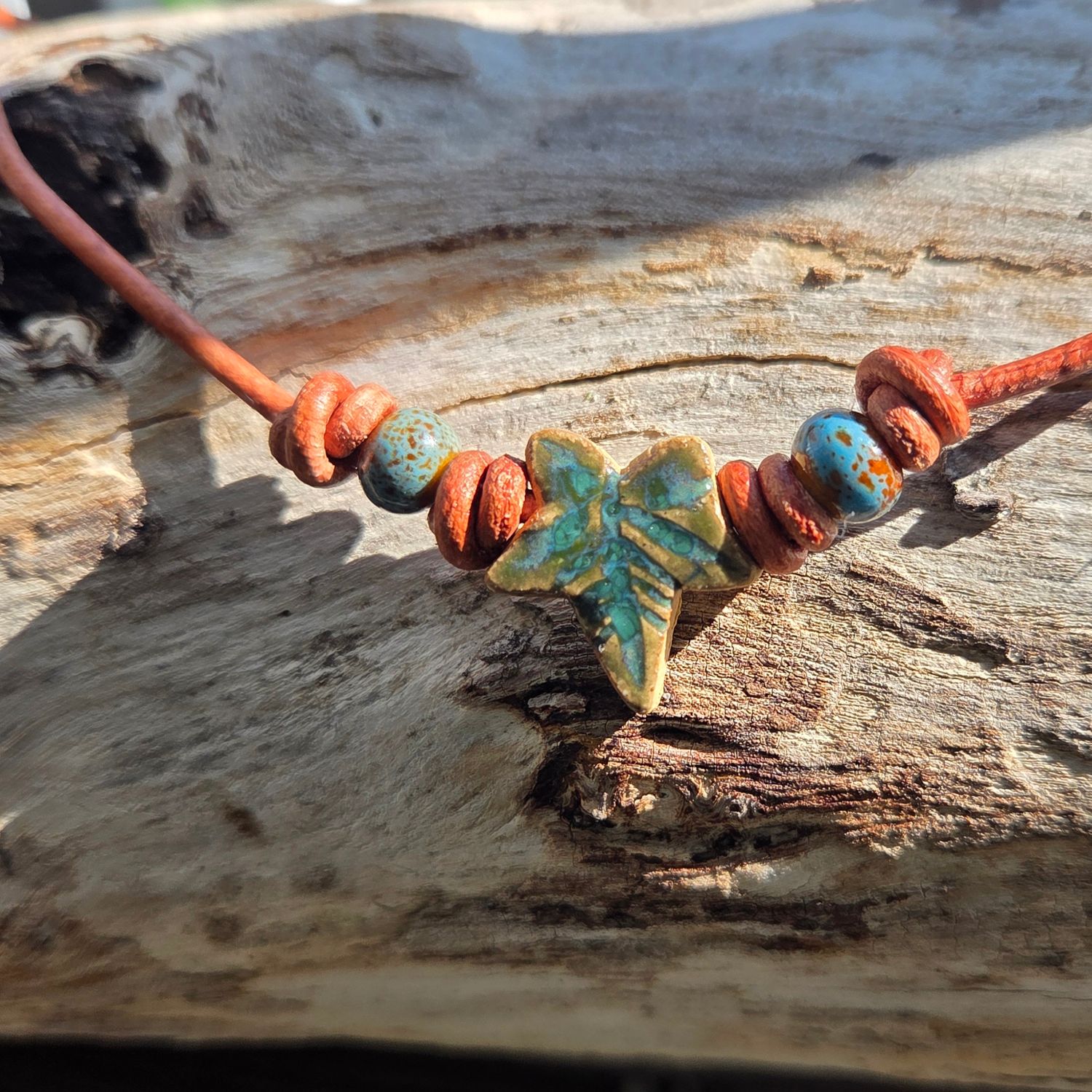 Ceramic pendant on leather cord