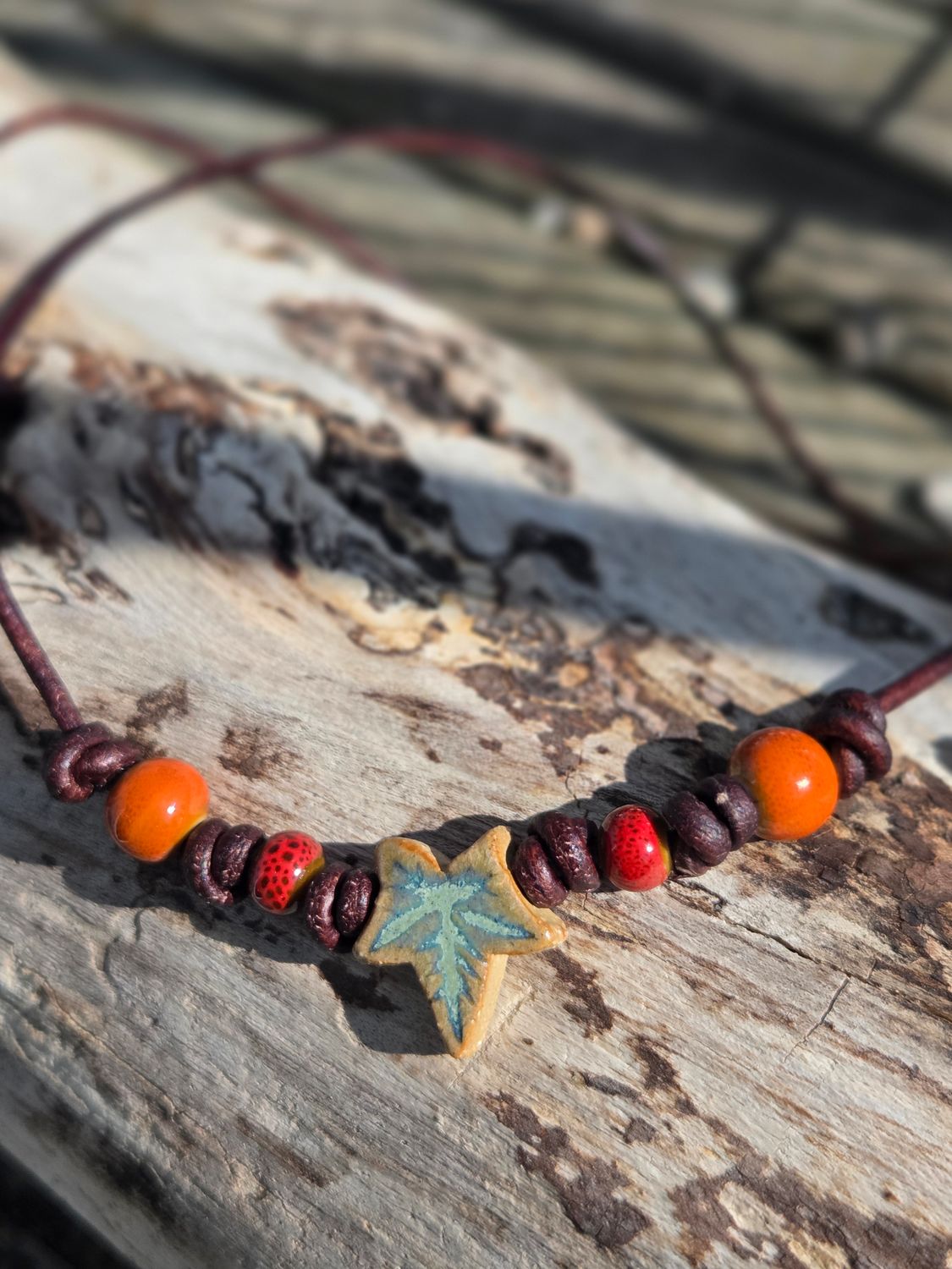 Ceramic pendant on leather cord