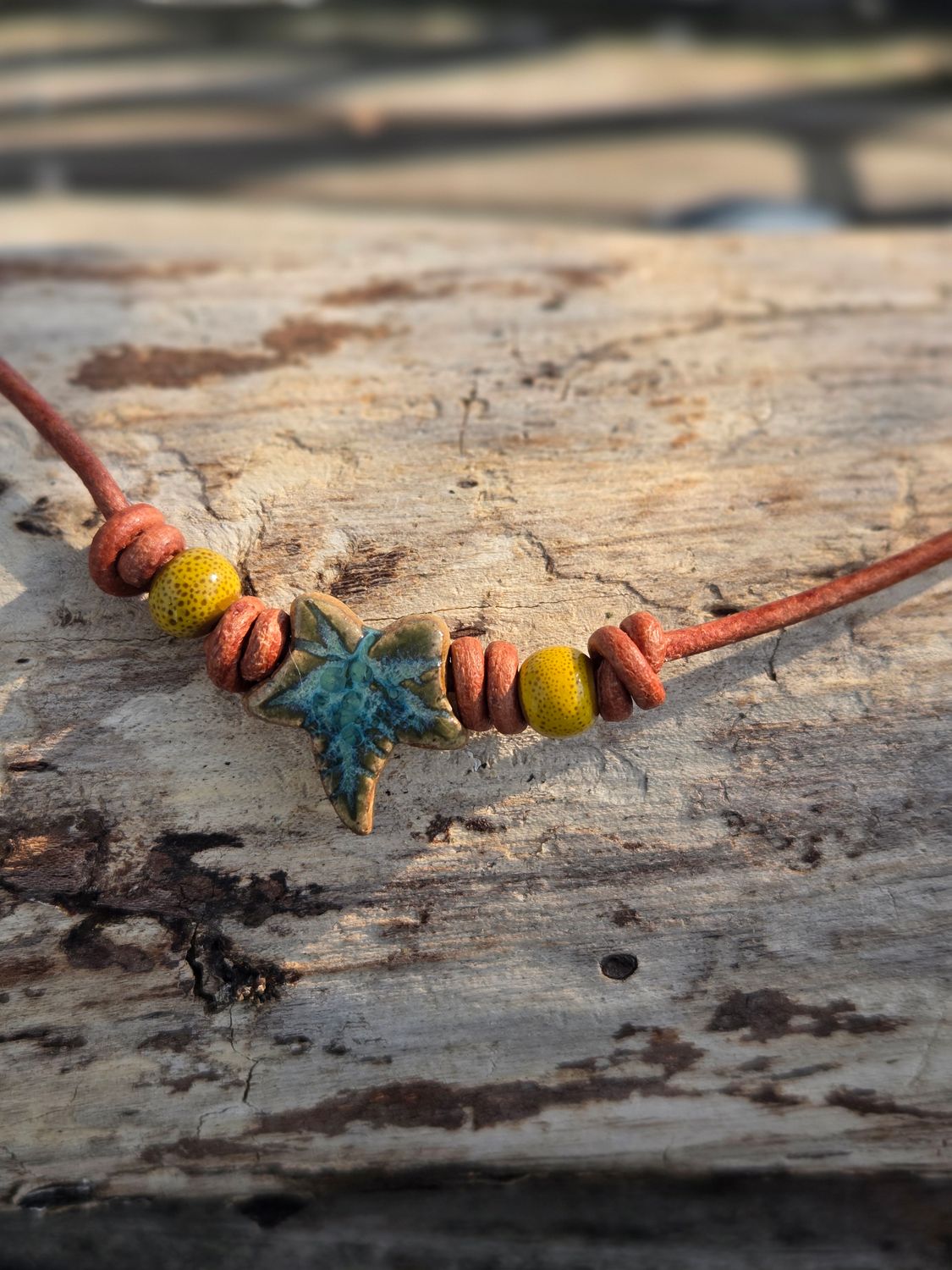Ceramic pendant on leather cord