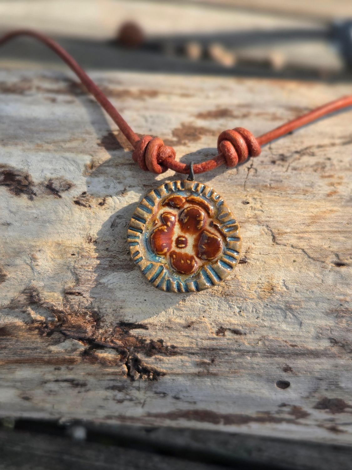 Ceramic pendant on leather cord