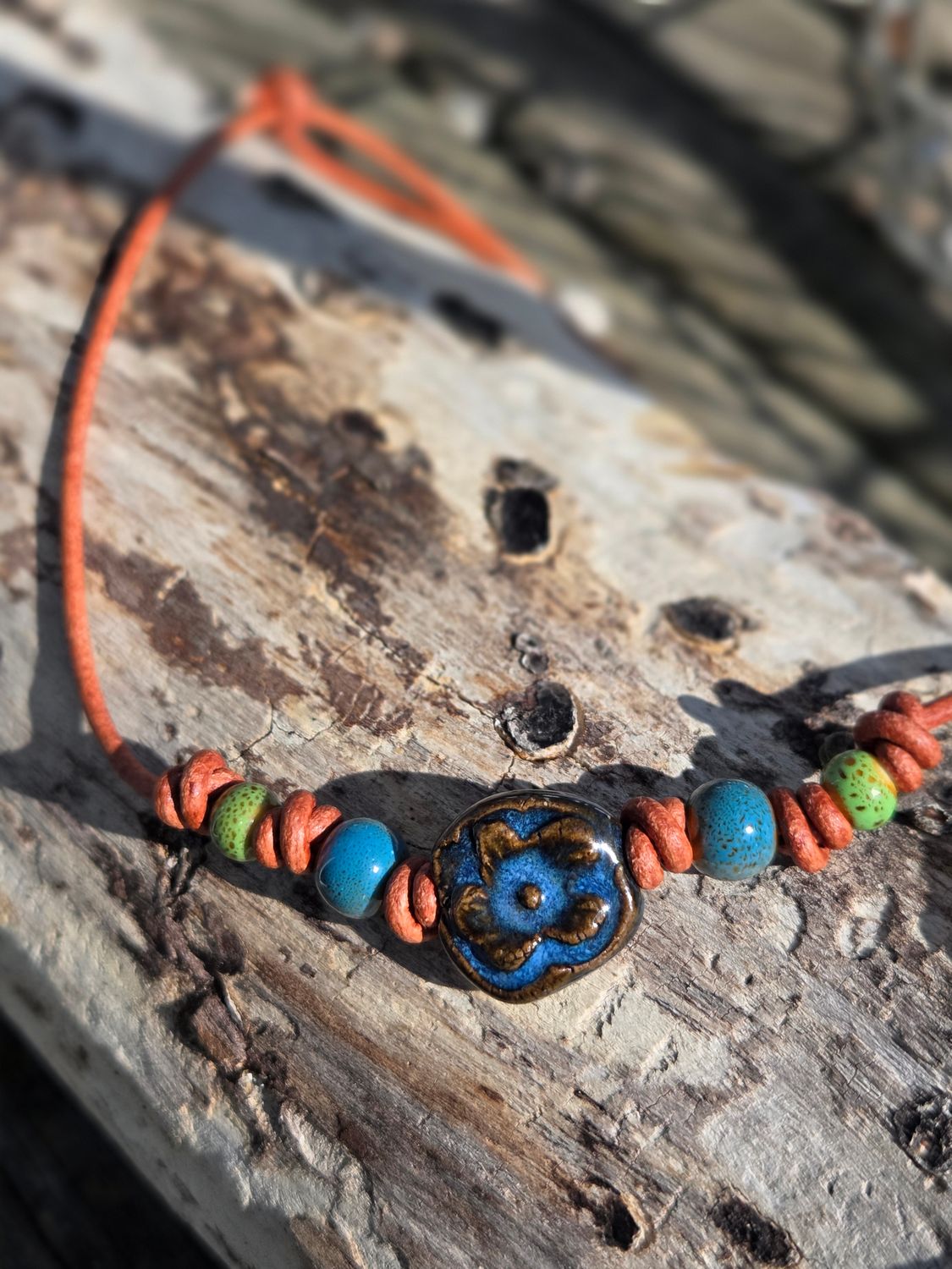 Ceramic pendant on leather cord