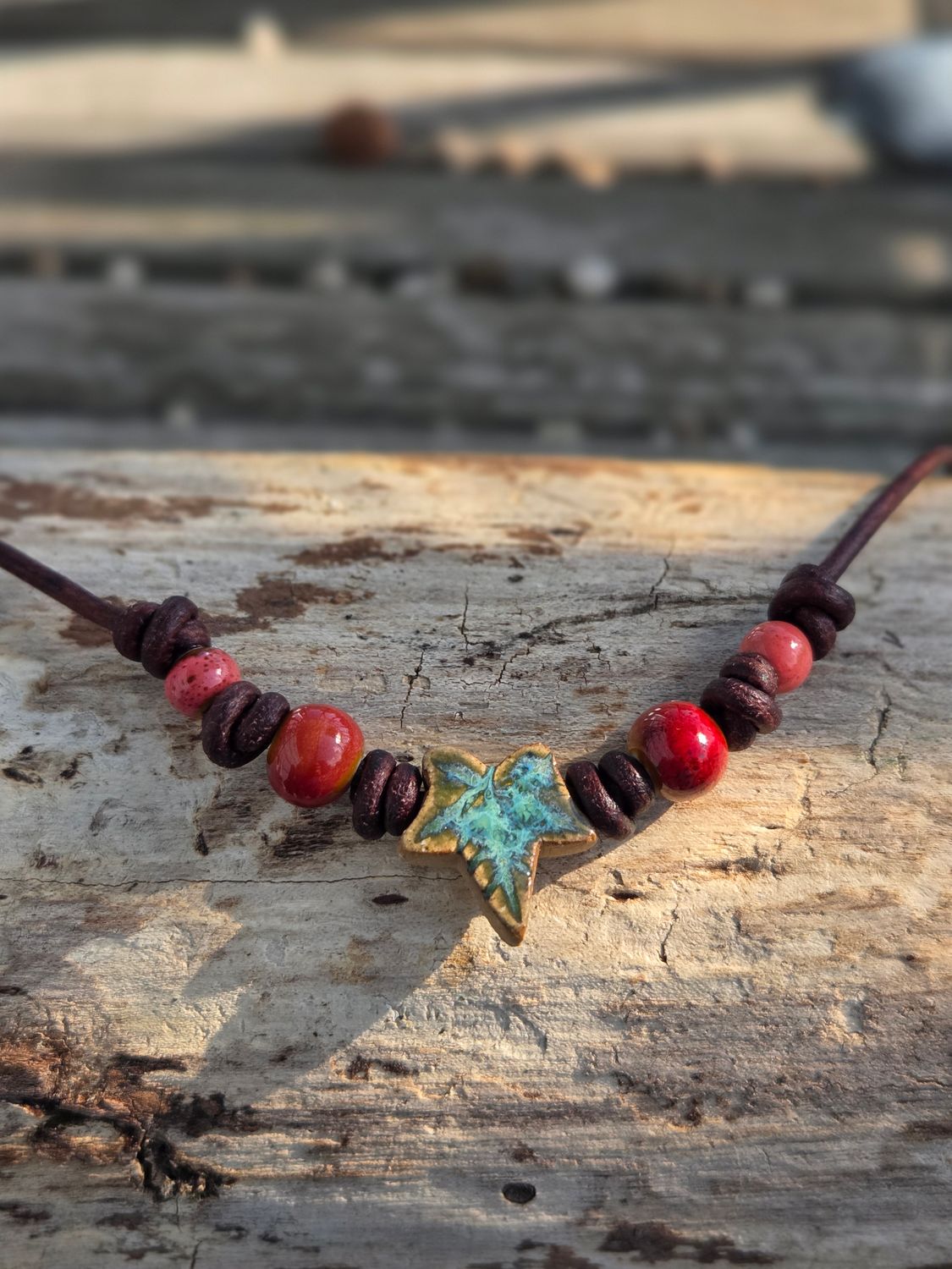 Ceramic pendant on leather cord