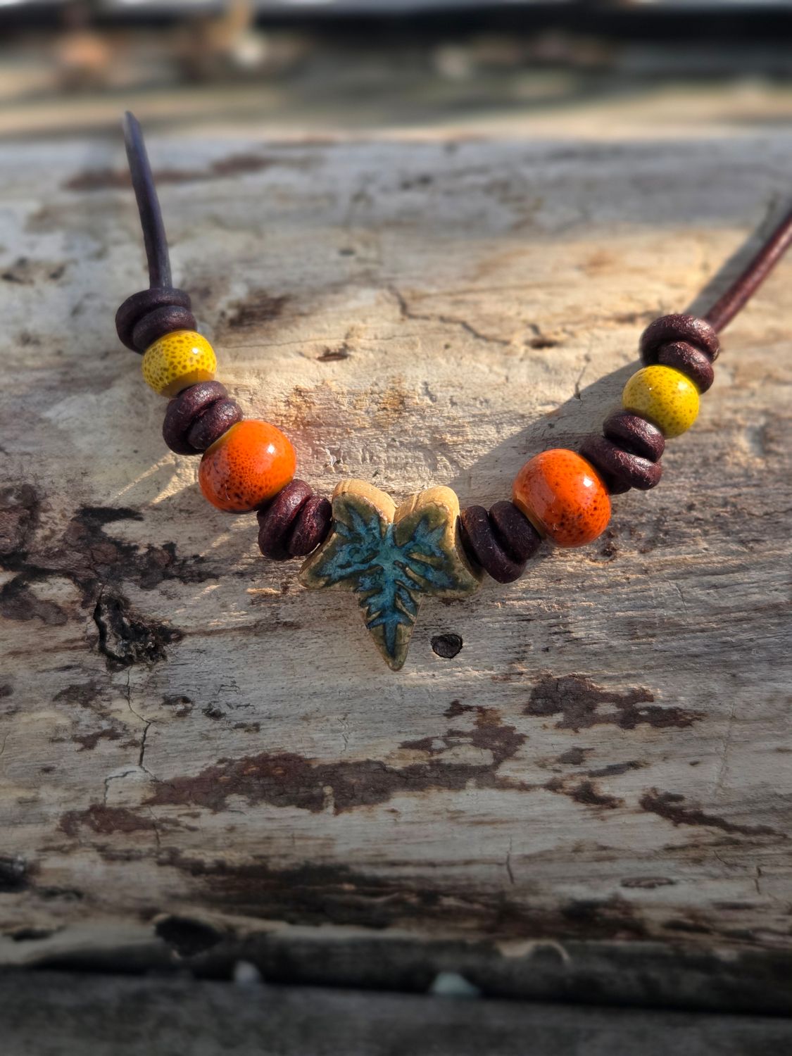 Ceramic pendant on leather cord
