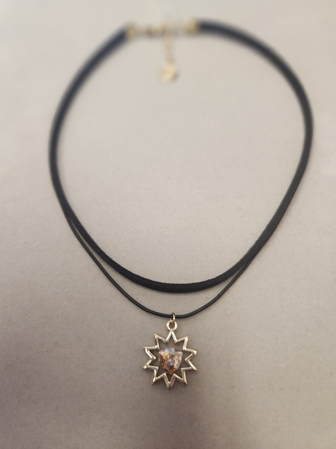 Black Chocker with gold starburst and amber stone