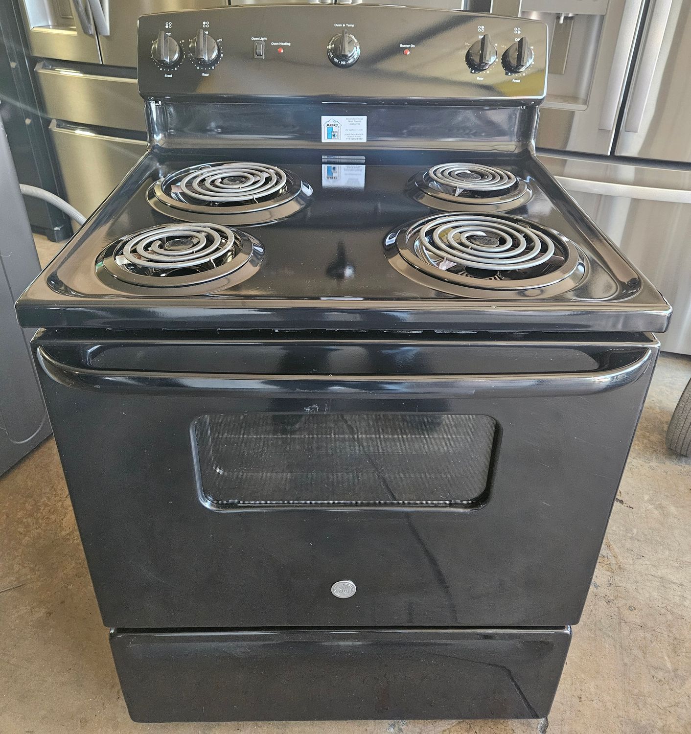 USED 30in GE Electric Coil-Top 4-Burner Range in Black