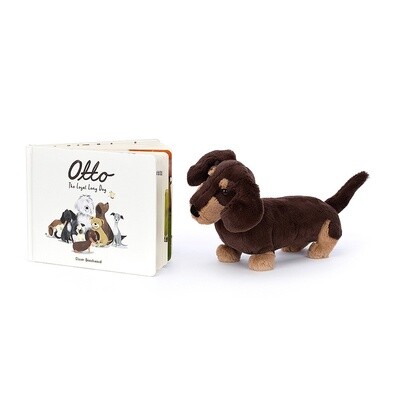 Jellycat Otto the Loyal Long Dog hardback picture book displayed on a soft surface in a home setting.