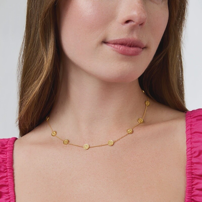 Julie Vos Valencia necklace in 24K gold featuring coin stations on an adjustable chain, worn in a lifestyle setting.