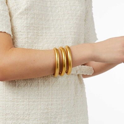 Julie Vos Havana bangle in 24K gold-plate with hand-hammered texture worn on wrist in lifestyle setting