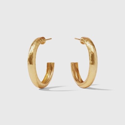 Julie Vos Havana hand-hammered hoop earrings in 24K gold plate, worn in a lifestyle setting