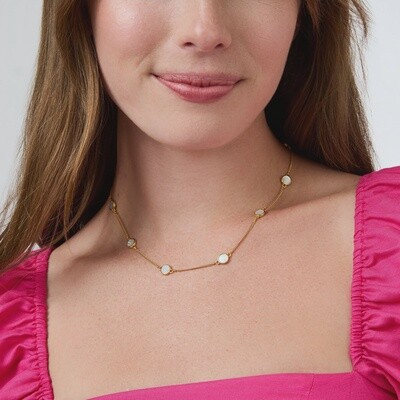 Julie Vos Valencia mother of pearl necklace in 24K gold worn as a layered pendant against neutral clothing