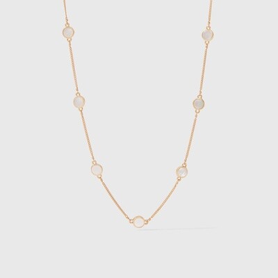 Julie Vos Valencia necklace with nine mother of pearl stations in 24-karat gold on a neutral background