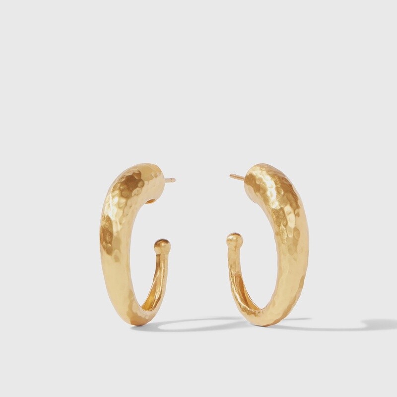 Julie Vos hammered hoop earrings in 24K gold plate worn in a lifestyle setting