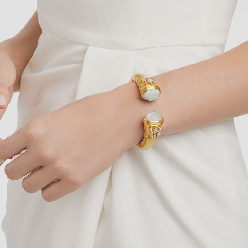 Julie Vos Cannes gilded cuff bracelet with rose-cut gemstones worn on wrist in lifestyle setting