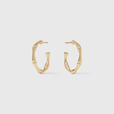 Julie Vos bamboo hoop earrings in 24k gold plate, shown as pierced pair against neutral background