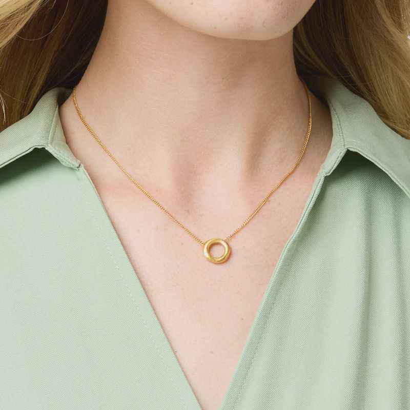 Julie Vos Wave Circle necklace in 24K gold plate, adjustable 16.5 inch length, worn in a lifestyle setting