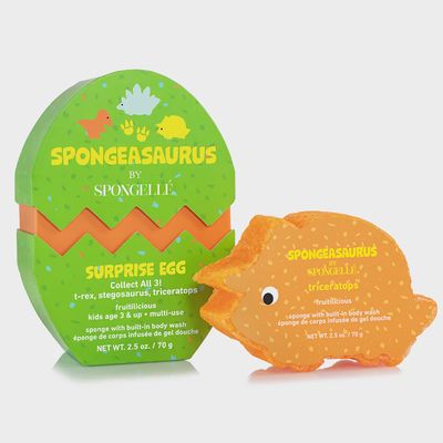 Spongellé Triceratops dinosaur-shaped body wash buffer in surprise dino egg packaging against a white background