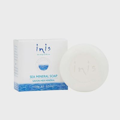 INIS sea mineral soap triple-milled round bar, 3.5 oz, displayed against a neutral background in studio lighting