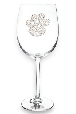 Clear stemmed wine glass with paw print design on the bowl, isolated on white background