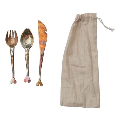 Hand-forged copper appetizer cutlery set with three pieces displayed on a neutral background, showing artisanal metalwork detail.