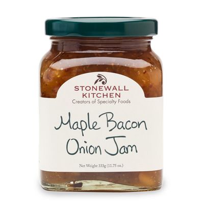 Stonewall Kitchen Maple Bacon Onion Jam in a glass jar with label, shot against a neutral background