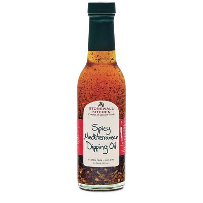 Stonewall Kitchen Spicy Mediterranean Dipping Oil bottle with chili and garlic on a neutral background