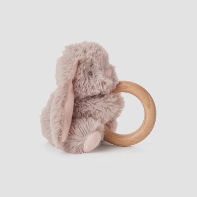Taupe bunny plush toy with natural wood ring rattle, displayed in a soft lifestyle setting