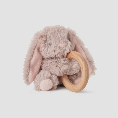 Taupe bunny plush toy with natural wood ring rattle attached, displayed on white background