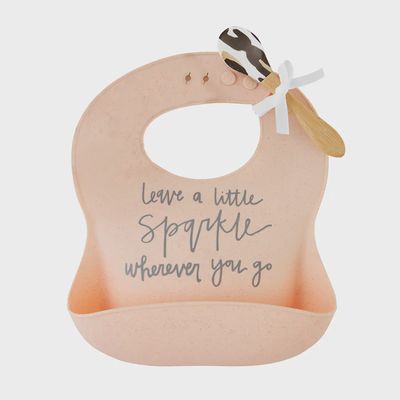Mud Pie Sparkle silicone baby bib and matching spoon set displayed on white background