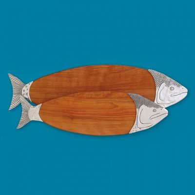 Yellow birch wood cutting and serving board with salmon-shaped design on neutral background