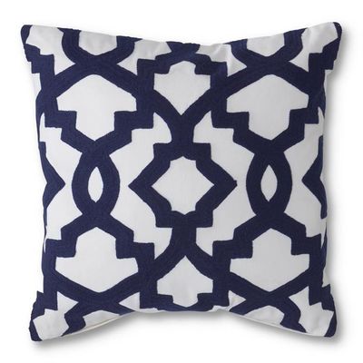 White and blue geometric cotton throw pillow, 18x18 inches, displayed on a neutral background in studio lighting