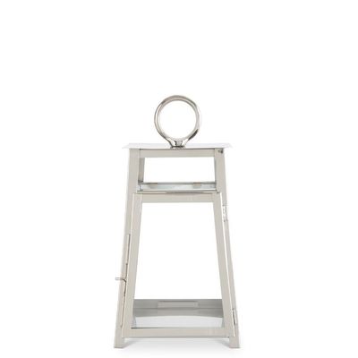 Silver metal trapezoid lantern with a ring handle photographed against a white studio background