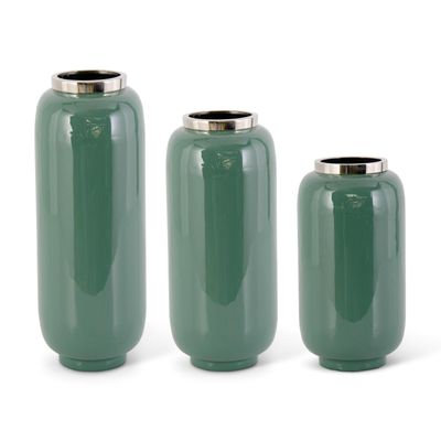 Green enameled iron vase with brass accents and silver rim, displayed against a neutral studio background
