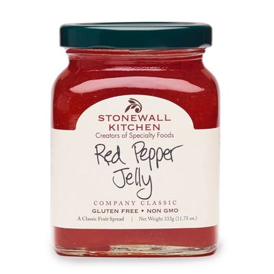 Stonewall Kitchen Red Pepper Jelly Sweet Cayenne in a clear glass jar with red preserve filling and branded label against white background