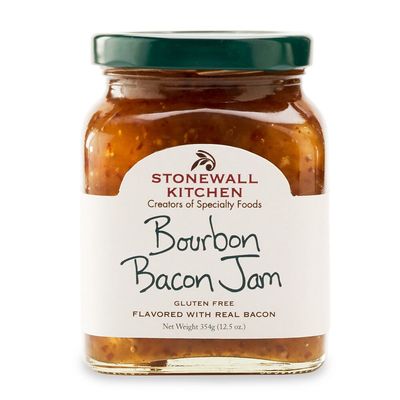 Stonewall Kitchen Bourbon Bacon Jam in a clear glass jar with label, photographed against a white background