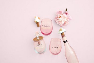 Engaged Ombre stemless wine glasses arranged on a table with gradient color tones from light to dark