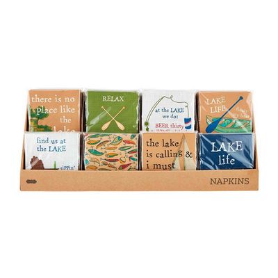 Pack of twelve Lake paper cocktail napkins by Mud Pie arranged on a table surface