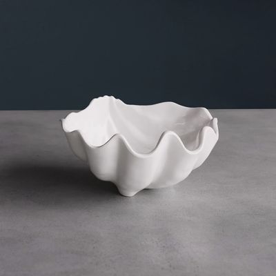 White melamine Ocean Shell small bowl by Beatriz Ball displayed against a neutral background in studio lighting