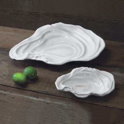 White ceramic small bowl from the VIDA Ocean Oyster collection displayed in a lifestyle setting with natural lighting and tabletop styling.
