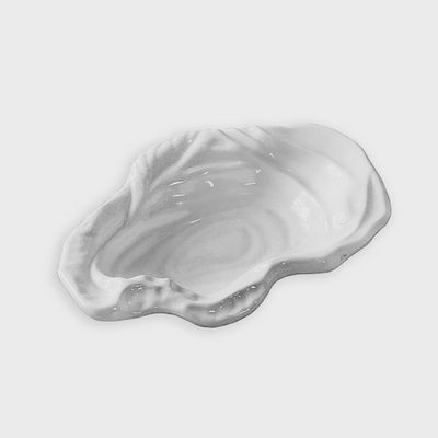 White ceramic VIDA Ocean Oyster small bowl photographed against a neutral background in studio lighting